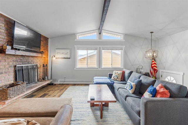 821 Pitkin St Unit 8, Frisco, CO 80443 - living room featuring wood finished floors, a fireplace, a chandelier, and baseboards