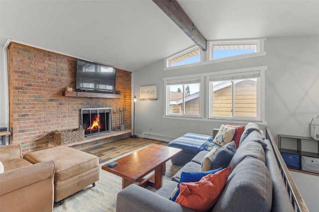 821 Pitkin St Unit 8, Frisco, CO 80443 - living room featuring a fireplace, wood finished floors, a baseboard radiator, and baseboards