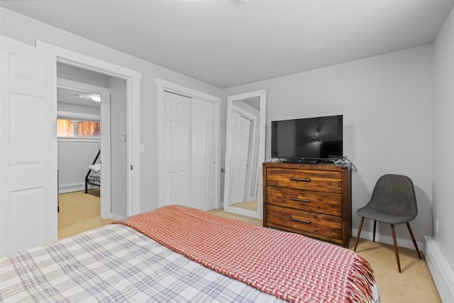 821 Pitkin St Unit 8, Frisco, CO 80443 - bedroom featuring light colored carpet, baseboards, a closet, and a baseboard radiator