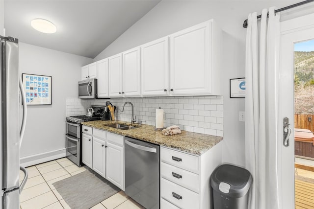 821 Pitkin St Unit 8, Frisco, CO 80443 - kitchen with stainless steel appliances, a sink, tasteful backsplash, lofted ceiling, and white cabinetry