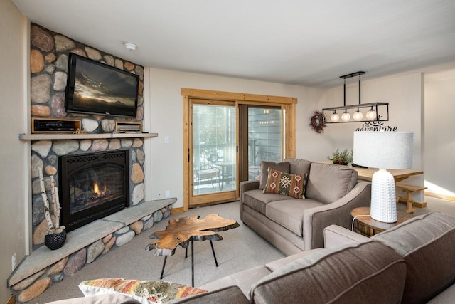 carpeted living room featuring a fireplace