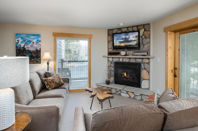 living room with a stone fireplace