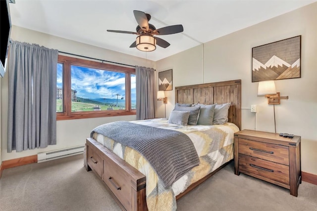 1995 Storm Meadows Dr Unit 307, Steamboat Springs, CO 80487 - bedroom featuring a baseboard heating unit, light colored carpet, and ceiling fan