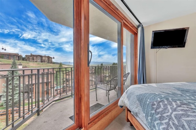1995 Storm Meadows Dr Unit 307, Steamboat Springs, CO 80487 - carpeted bedroom with lofted ceiling and access to outside