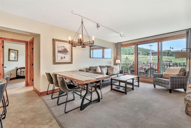1995 Storm Meadows Dr Unit 307, Steamboat Springs, CO 80487 - dining space featuring track lighting, a chandelier, and light tile patterned floors