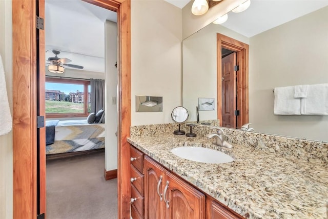 1995 Storm Meadows Dr Unit 307, Steamboat Springs, CO 80487 - bathroom featuring vanity, connected bathroom, and a ceiling fan