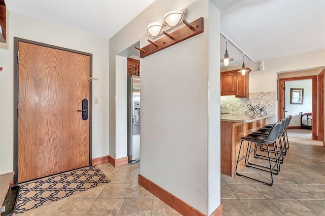 1995 Storm Meadows Dr Unit 307, Steamboat Springs, CO 80487 - foyer with light tile patterned floors and baseboards