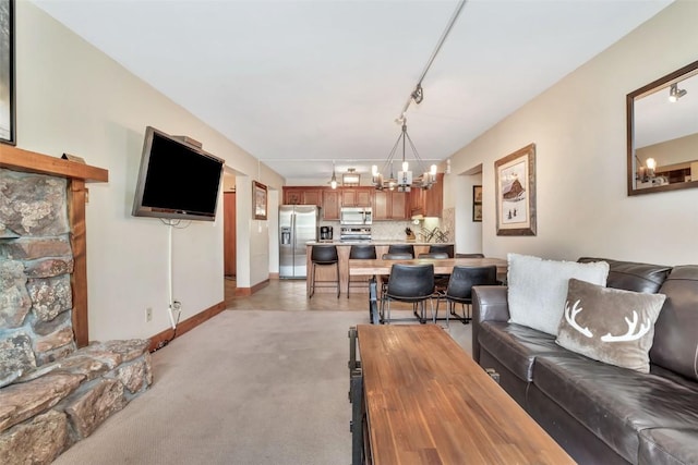 1995 Storm Meadows Dr Unit 307, Steamboat Springs, CO 80487 - living room featuring a chandelier and light carpet