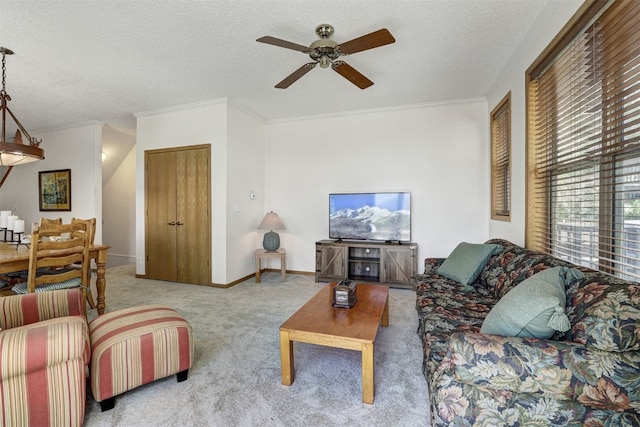 307 Saddle Ridge Dr Unit 307, Wildernest, CO 80498 - living room featuring a ceiling fan, carpet floors, ornamental molding, and a textured ceiling