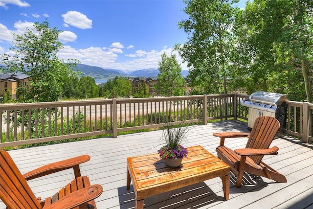 307 Saddle Ridge Dr Unit 307, Wildernest, CO 80498 - wooden terrace featuring a mountain view and area for grilling
