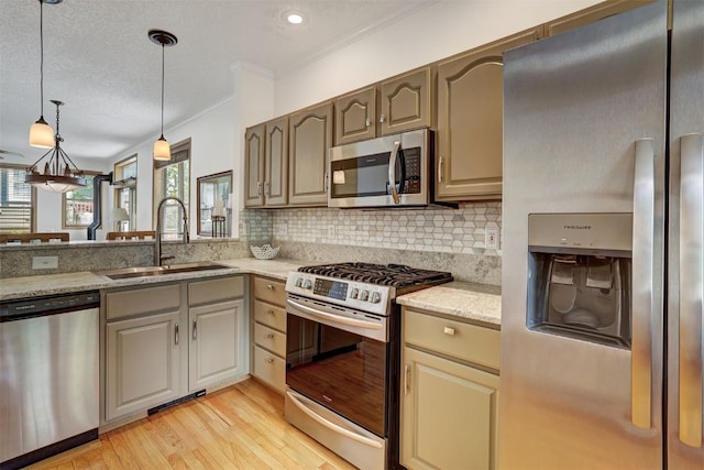 307 Saddle Ridge Dr Unit 307, Wildernest, CO 80498 - kitchen featuring stainless steel appliances, light wood-style floors, backsplash, crown molding, and light stone countertops