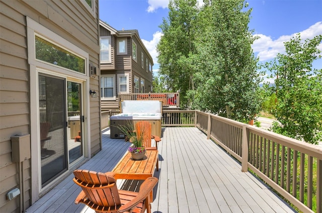 307 Saddle Ridge Dr Unit 307, Wildernest, CO 80498 - deck featuring a hot tub and grilling area