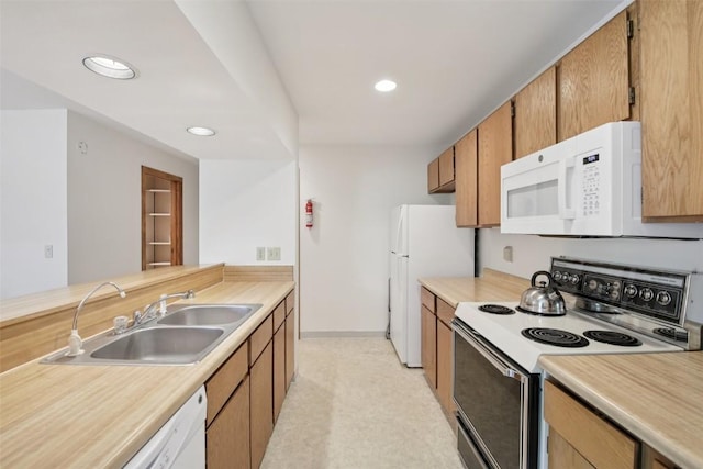 210 E Ln Bonte St Unit 121, Dillon, CO 80435 - kitchen featuring white appliances, light countertops, recessed lighting, and brown cabinetry