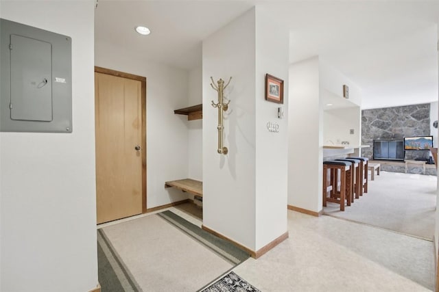 210 E Ln Bonte St Unit 121, Dillon, CO 80435 - mudroom with electric panel and a stone fireplace