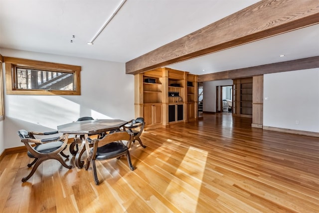 252 Lake View Dr, Silverthorne, CO 80498 - dining room with light wood-style floors, beamed ceiling, and baseboards