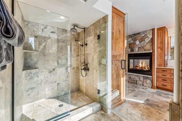 252 Lake View Dr, Silverthorne, CO 80498 - bathroom with a shower stall and a fireplace