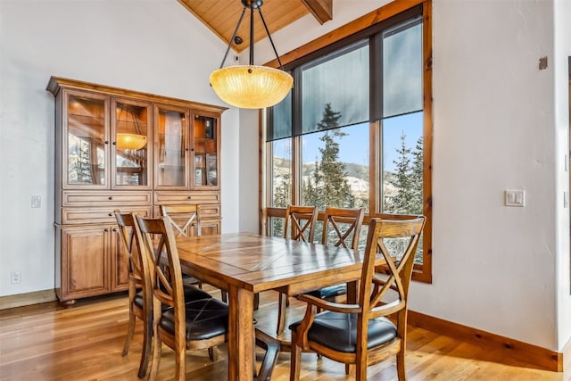 252 Lake View Dr, Silverthorne, CO 80498 - dining area with wood ceiling, light wood-style flooring, and baseboards