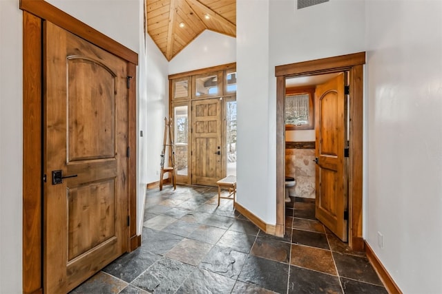 252 Lake View Dr, Silverthorne, CO 80498 - entrance foyer featuring baseboards, stone tile floors, recessed lighting, high vaulted ceiling, and wood ceiling