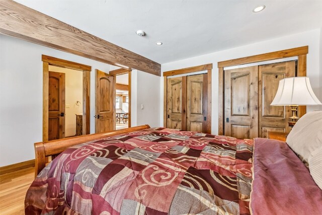 252 Lake View Dr, Silverthorne, CO 80498 - bedroom with wood finished floors, multiple closets, recessed lighting, and baseboards