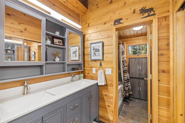 36 Silk Sisters Pl, Fairplay, CO 80440 - bathroom with wood walls, double vanity, shower / bath combo, and stone finish flooring