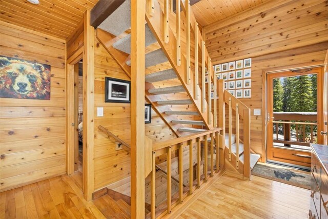 36 Silk Sisters Pl, Fairplay, CO 80440 - stairway with wooden walls, hardwood / wood-style floors, and wood ceiling