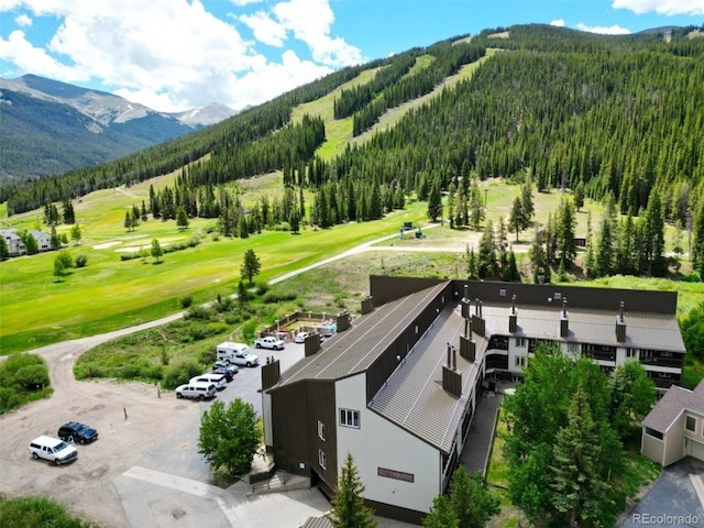 56 Uneva Pl Unit 105, Frisco, CO 80443 - aerial view of a mountainous background and a heavily wooded area