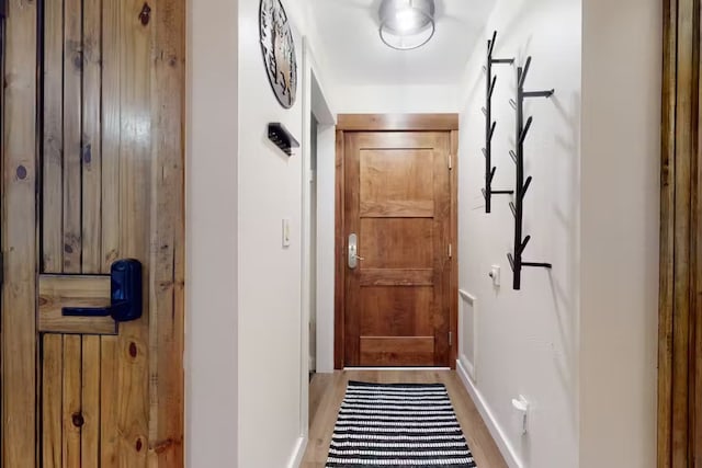56 Uneva Pl Unit 105, Frisco, CO 80443 - doorway to outside with baseboards and wood finished floors