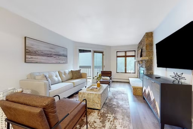 56 Uneva Pl Unit 105, Frisco, CO 80443 - living room featuring baseboard heating and wood finished floors