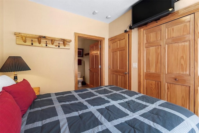 bedroom with connected bathroom