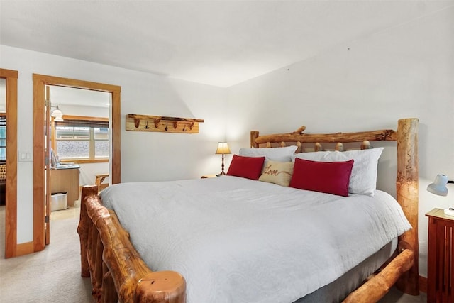 carpeted bedroom with baseboards