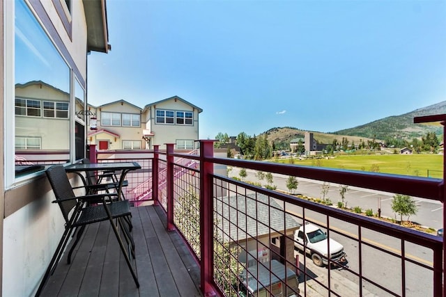 balcony featuring a mountain view