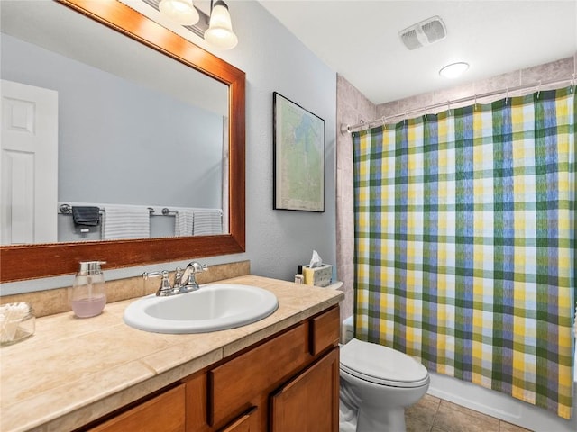 414 Tenderfoot St Unit 1, Dillon, CO 80435 - bathroom featuring vanity, toilet, and tile patterned flooring