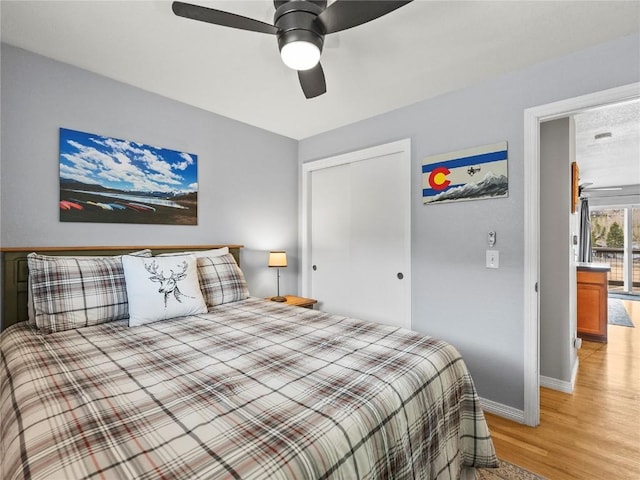 414 Tenderfoot St Unit 1, Dillon, CO 80435 - bedroom featuring light wood-style flooring, baseboards, a ceiling fan, and a closet