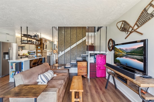 340 Straight Creek Dr Unit 206, Dillon, CO 80435 - living room with wood finished floors and a textured ceiling