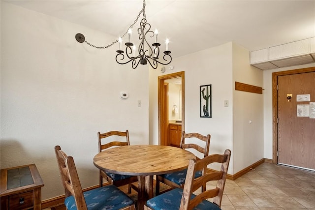 611 Village Rd Unit 21170, Breckenridge, CO 80424 - dining area with baseboards, a notable chandelier, and light tile patterned floors