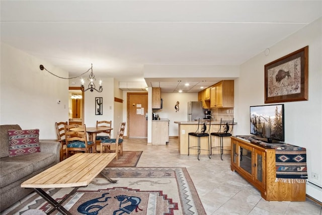 611 Village Rd Unit 21170, Breckenridge, CO 80424 - living area featuring baseboards, recessed lighting, and a notable chandelier