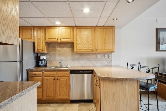 611 Village Rd Unit 21170, Breckenridge, CO 80424 - kitchen with recessed lighting, stainless steel appliances, a sink, a peninsula, and tasteful backsplash
