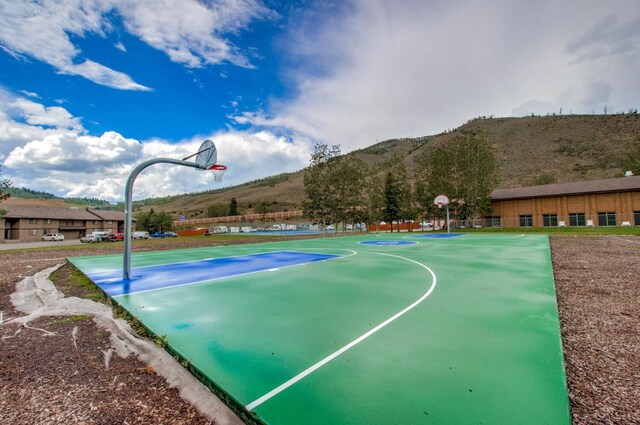 view of basketball court featuring a mountain view