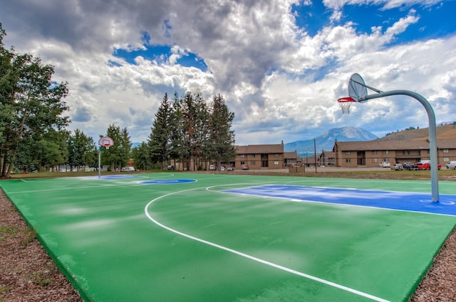 view of sport court with a mountain view