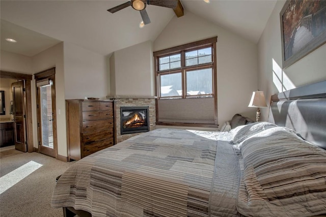 carpeted bedroom with vaulted ceiling with beams, ensuite bath, and ceiling fan