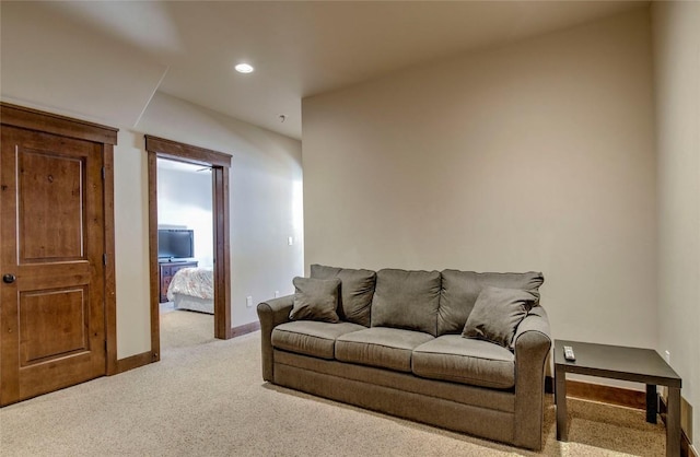 living room featuring light carpet