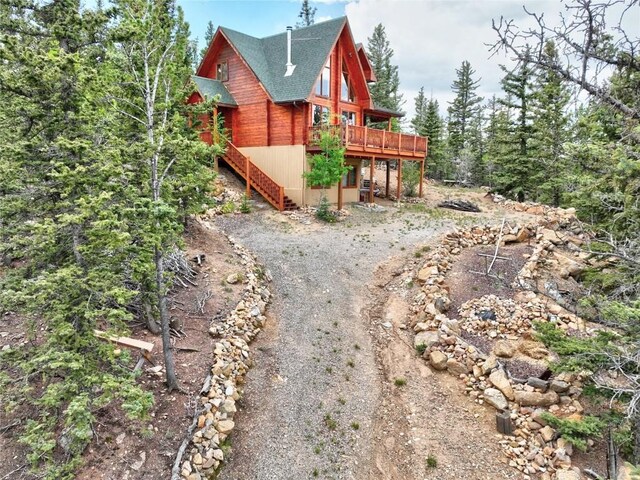 672 Wampum Ln, Como, CO 80432 - bedroom with wooden walls, lofted ceiling, carpet, and wood ceiling