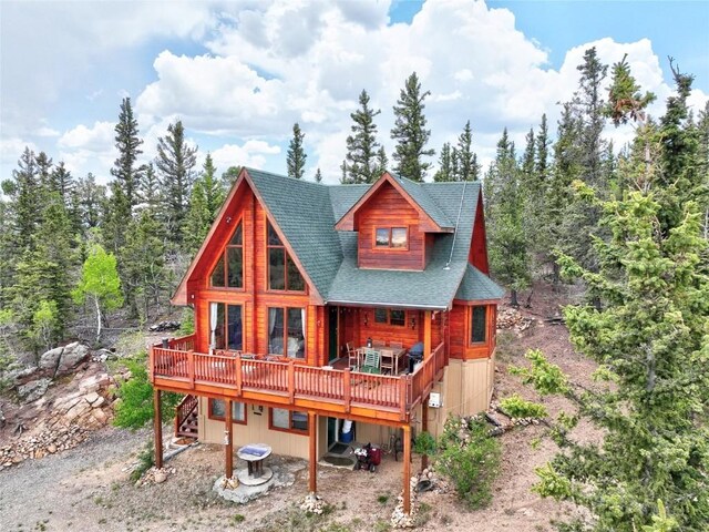 672 Wampum Ln, Como, CO 80432 - full bath with toilet, wood walls, tile patterned flooring, and a sink