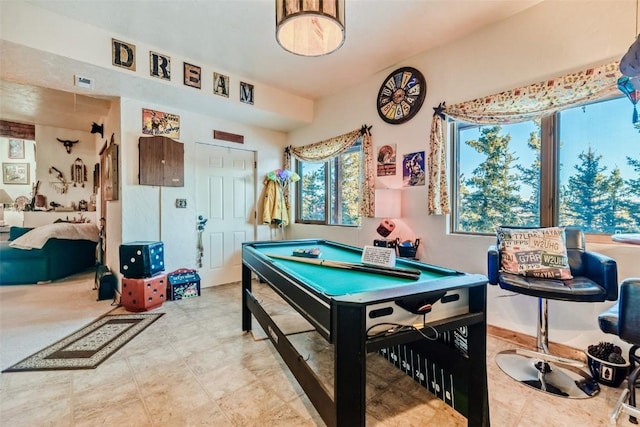 game room with pool table and plenty of natural light