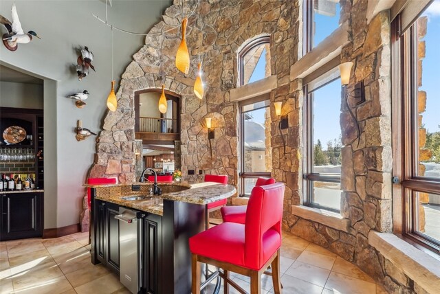 152 County Road 1040, Frisco, CO 80443 - bar with light tile patterned flooring, indoor wet bar, and a sink