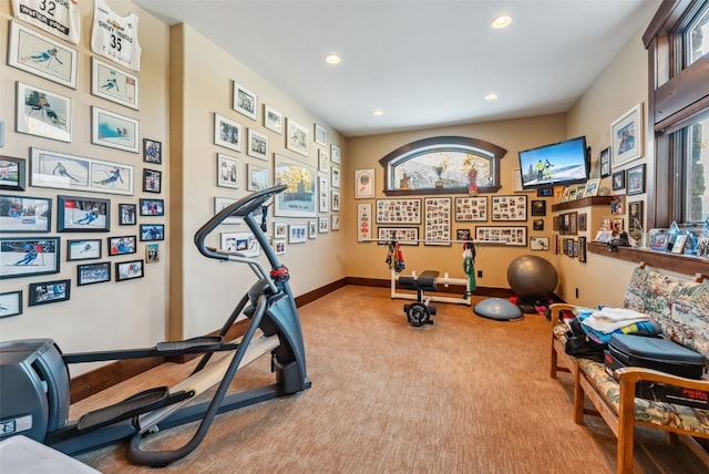 exercise room with carpet floors, baseboards, and recessed lighting