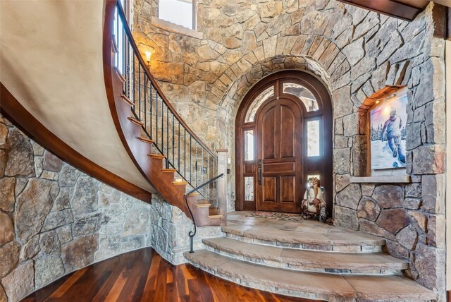 152 County Road 1040, Frisco, CO 80443 - foyer entrance with arched walkways, stairs, wood finished floors, and a wealth of natural light
