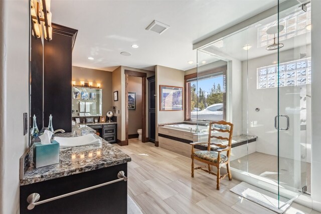 152 County Road 1040, Frisco, CO 80443 - bathroom with a shower stall, a bath, vanity, toilet, and visible vents