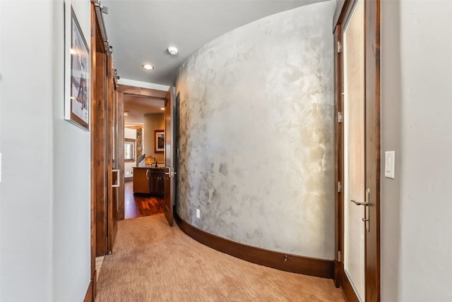 corridor featuring carpet and baseboards