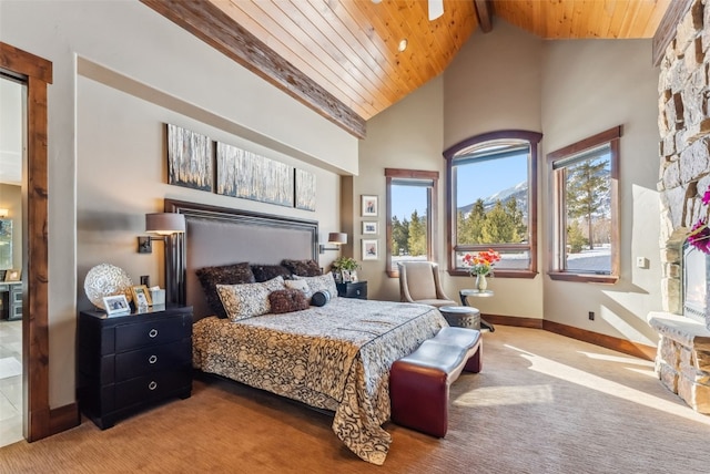 carpeted bedroom with wood ceiling, baseboards, beam ceiling, and high vaulted ceiling